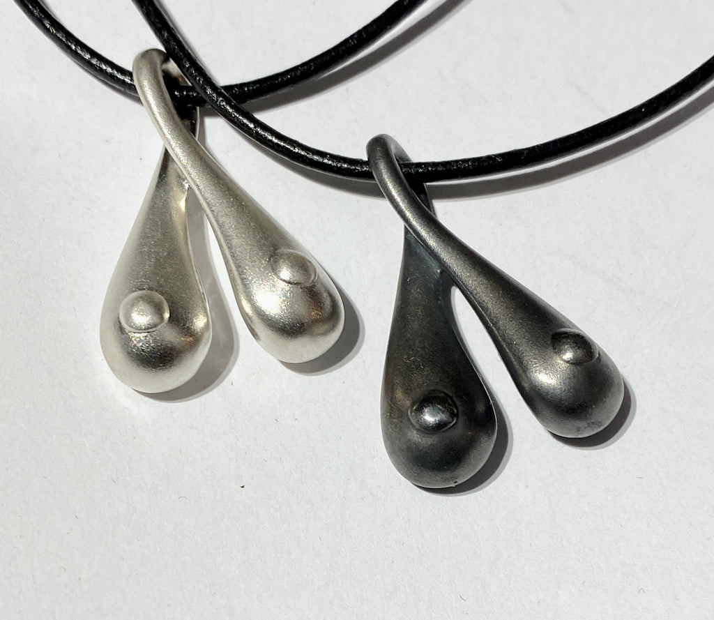Silver Boobs on a leather string!  October is breast cancer awareness month!
