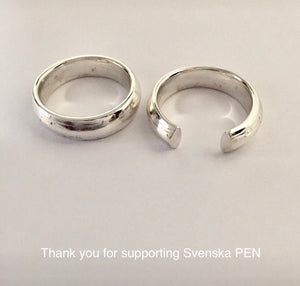 Sterling silver rings cast from real pencils without the point. One goes all the way around the finger like a wedding band and one is open on top.