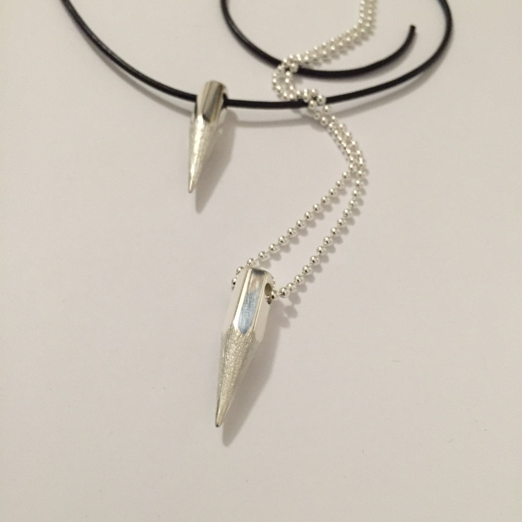 Sharp Words Pendant on a silver chain