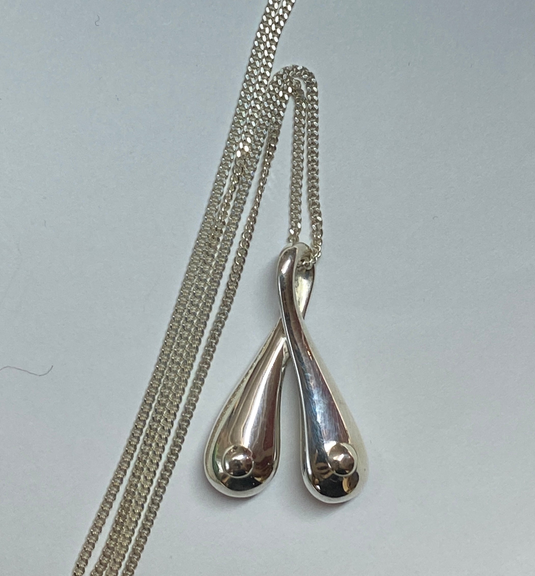 Silver Boobs on a 70 cm long sterling silver curb chain