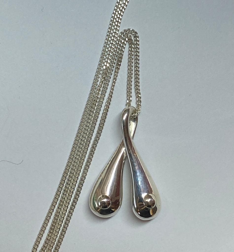 Silver Boobs on a 70 cm long sterling silver curb chain
