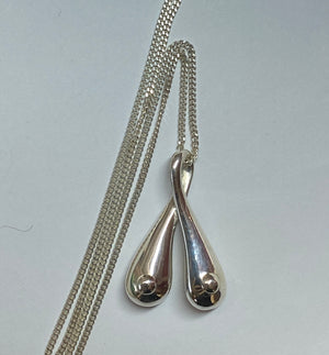 Silver Boobs on a 70 cm long sterling silver curb chain