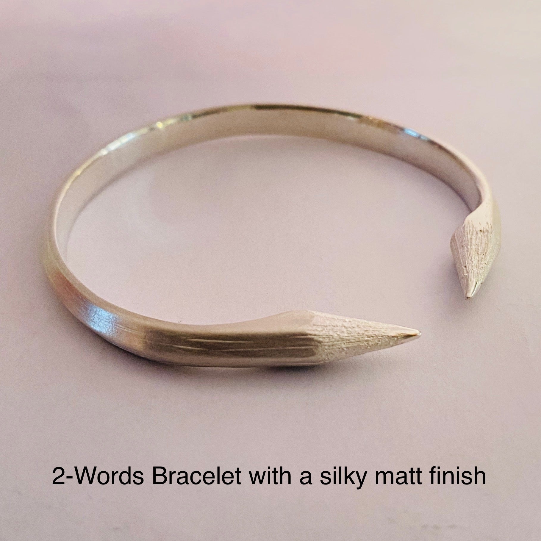 Sterling silver bracelet or bangle made from a real pencil. wit 2 pencil-heads almost meeting at the ends