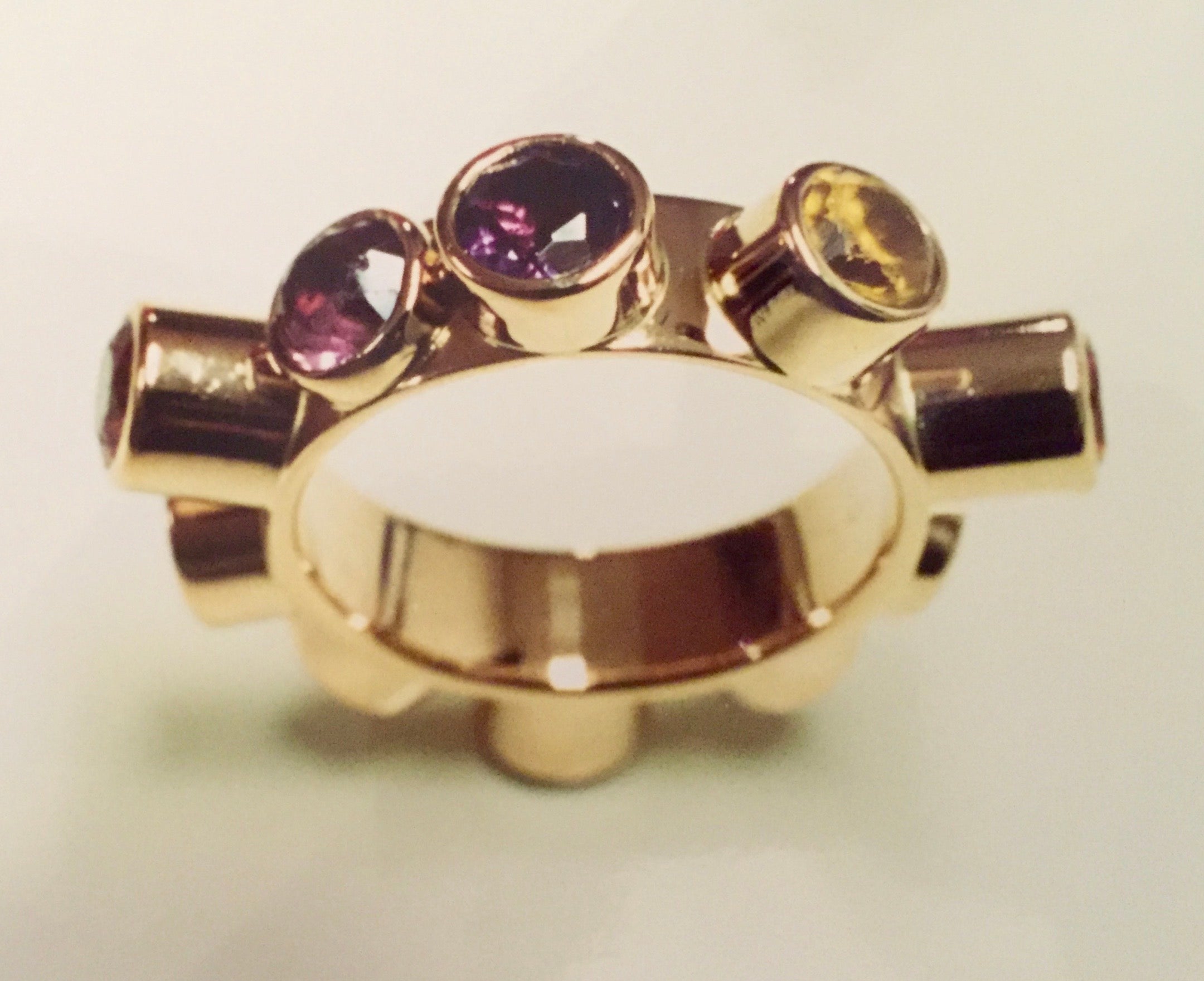 From the Illusions exhibition A one-finger ring with different precious stones all around