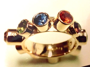 From the Illusions exhibition A one-finger ring with different precious stones all around